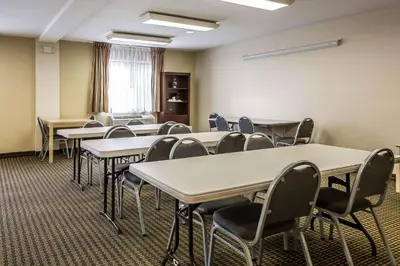 a classroom with rows of tables and chairs at Econo Lodge Inn & Suites Monroe in Monroe