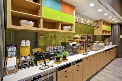 a kitchen with a counter with aasteryasteryasteryasteryasteryasteryasteryasteryastery at Home2 Suites By Hilton Columbus Downtown in Columbus