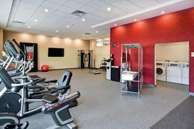 a gym with cardio equipment in a room at Home2 Suites By Hilton Columbus Downtown in Columbus