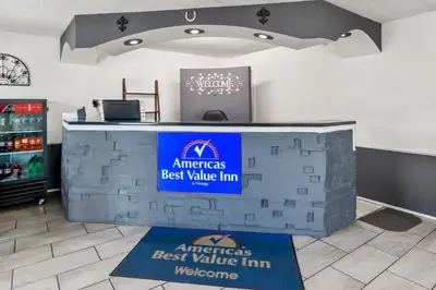 a counter in a store with a sign on it at Americas Best Value Inn & Suites Williamstown in Williamstown