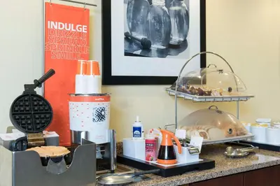 a counter with some food on it in a hotel room at Hampton Inn Cincinnati Airport South in Florence