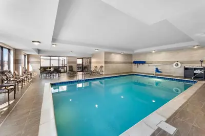 a pool with blue water in a hotel room at Hampton Inn Dayton/Huber Heights in Huber Heights