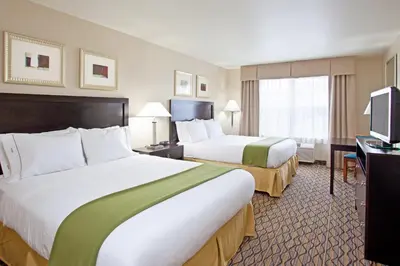 a hotel room with two beds and a television at Holiday Inn Express & Suites Columbus East - Reynoldsburg by IHG in Reynoldsburg