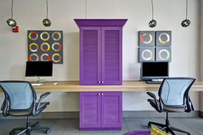 an office with a purple desk and two chairs at Home2 Suites By Hilton Blue Ash Cincinnati in Blue Ash