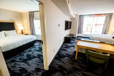 a hotel room with two beds and a desk at Fairfield by Marriott Inn & Suites Washington Casino Area in Washington