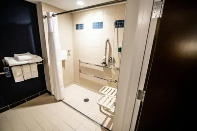 a bathroom with a shower with a glass door at Fairfield by Marriott Inn & Suites Washington Casino Area in Washington
