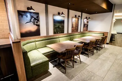 a row of tables and chairs in a restaurant at Fairfield by Marriott Inn & Suites Washington Casino Area in Washington