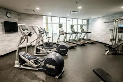 a gym with a row of treadms and cardio machines at Fairfield by Marriott Inn & Suites Washington Casino Area in Washington