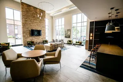 a lobby with a table and chairs and a living room at Fairfield by Marriott Inn & Suites Washington Casino Area in Washington