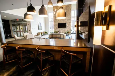 a kitchen and living room with a bar and chairs at Fairfield by Marriott Inn & Suites Washington Casino Area in Washington