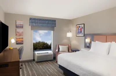 a hotel room with a bed and a window at Hampton Inn & Suites Cleveland-Mentor in Mentor