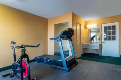 a gym with a treadmill and a bike in a room at Days Inn by Wyndham Anderson IN in Anderson