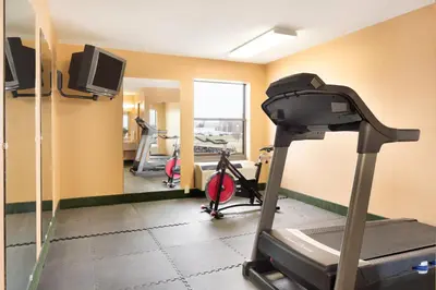 a room with a gym with a treadmill and a tv at Days Inn by Wyndham Anderson IN in Anderson