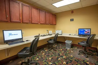 an office cubicle with two desks and two computers at Hampton Inn & Suites Dayton-Airport in Englewood