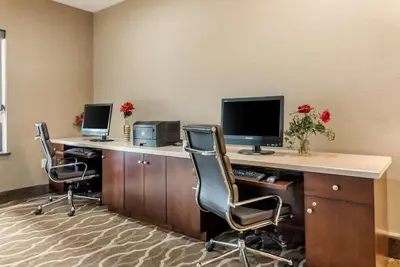 an office with two desks with two monitors and two chairs at Comfort Suites Dayton-Wright Patterson in Dayton