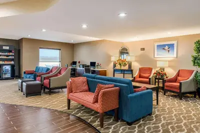 a lobby with couches and chairs in a waiting room at Comfort Suites Dayton-Wright Patterson in Dayton
