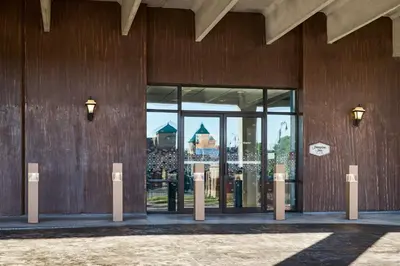 a facade of a building with glass doors at Hampton Inn Massillon in Massillon