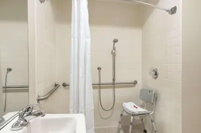 a bathroom with a shower and a sink at Baymont by Wyndham Winchester in Winchester
