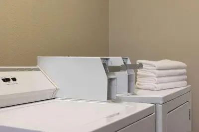 a dryer sitting on top of a counter with towels at Baymont by Wyndham Winchester in Winchester