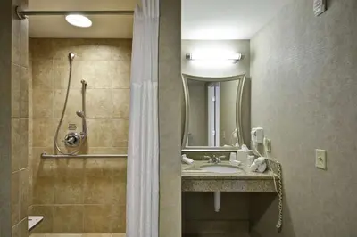 a bathroom with a sink and a shower at Hilton Garden Inn Toledo / Perrysburg in Perrysburg