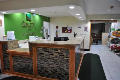 a lobby of a dental office with a green wall at Quality Inn Washington Court House in Jeffersonville