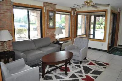 a living room with a couch and two chairs and a table at Quality Inn Washington Court House in Jeffersonville