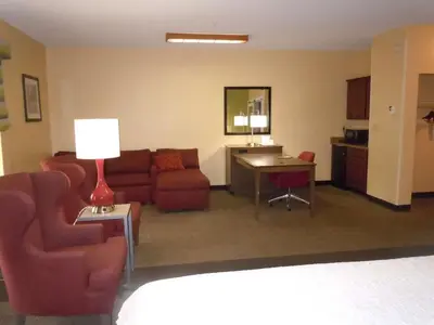 a living room with a couch and a table at Hampton Inn Shelbyville in Shelbyville