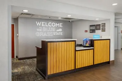 a welcome to the bluegrass state sign on a wall at Hampton Inn Carrollton KY in Carrollton
