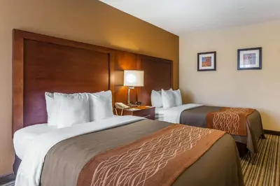 a hotel room with two beds in a room at Comfort Inn - Hall of Fame in Canton