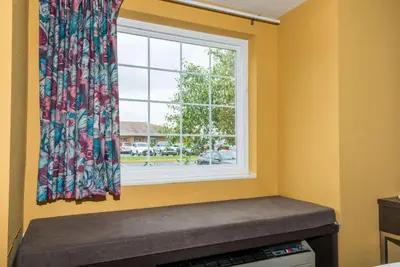 a window with a window seat in a room at Microtel Inn & Suites by Wyndham Riverside in Dayton