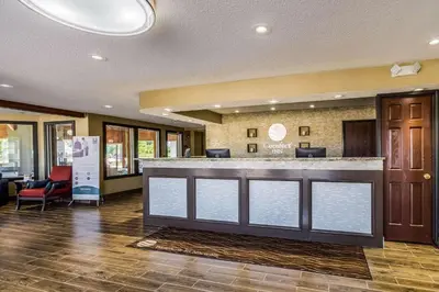 a lobby of a hospital with a reception counter at Comfort Inn Norwalk - Sandusky in Norwalk