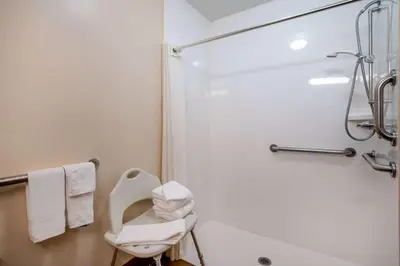 a bathroom with a toilet and a shower at Super 8 by Wyndham Columbus West in Columbus