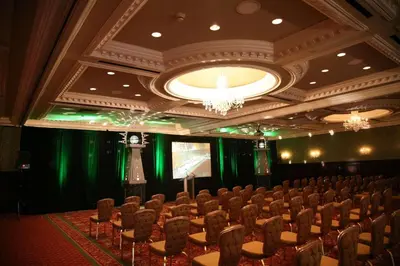a conference room with chairs and a projection screen at Radisson Hotel Cincinnati Riverfront in Covington