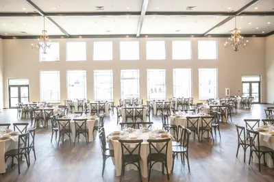 a banquet hall with tables and chairs in it at Berlin Encore Hotel & Suites in Berlin