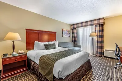 a hotel room with a large bed and a window at Best Western Plus Bridgeport Inn in Bridgeport