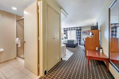 a hotel room with a bathroom and a bedroom at Best Western Plus Bridgeport Inn in Bridgeport