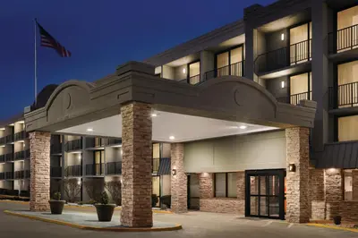 an exterior view of a hotel at night at Country Inn & Suites by Radisson, Erlanger - Cincinnati South in Erlanger