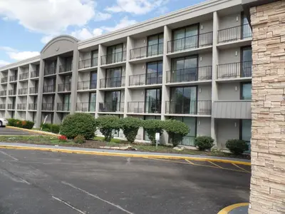 an empty street in front of an apartment building at Country Inn & Suites by Radisson, Erlanger - Cincinnati South in Erlanger