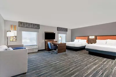 a hotel room with two beds and a desk at Hampton Inn & Suites Richmond in Richmond
