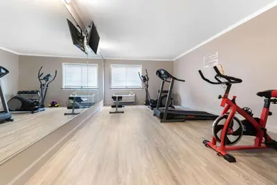 a gym with treadmills and exercise bikes in a room at Quality Inn Fairborn near Wright Patterson AFB in Fairborn