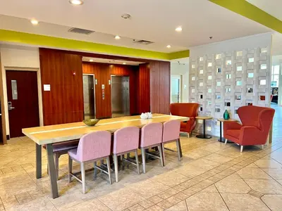 a conference room with a wooden table and chairs at Holiday Inn Toledo - Maumee I-80/90 by IHG in Maumee