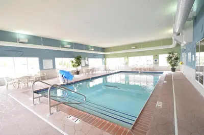 a large swimming pool in a hotel room at Holiday Inn Express Toledo-Oregon by IHG in Oregon