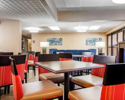 a dining room filled with tables and chairs at Comfort Inn Dayton - Huber Heights in Huber Heights