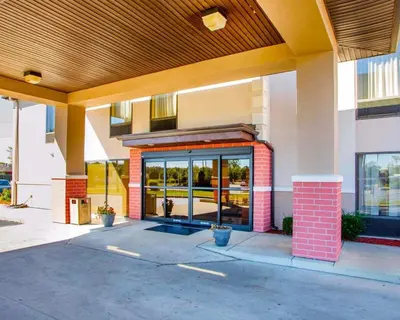 a front of a building with a large glass door at Comfort Inn Dayton - Huber Heights in Huber Heights