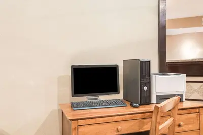 a desk with a computer and a printer on it at Hawthorn Extended Stay by Wyndham Dayton in Dayton