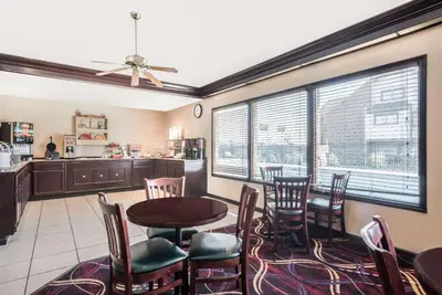 a kitchen and dining room with a table and chairs at Hawthorn Extended Stay by Wyndham Dayton in Dayton