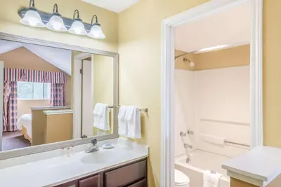 a bathroom with a sink and a mirror at Hawthorn Extended Stay by Wyndham Dayton in Dayton