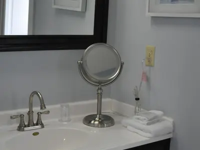 a bathroom sink with a mirror on top of it at The Doctor's Inn in Oxford