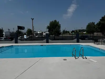a blue swimming pool with a pair of tongs in it at Quality Inn & Suites in Cincinnati