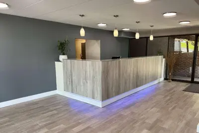 an empty office with a lobby with a reception desk at Days Inn by Wyndham Cincinnati East in Cherry Grove
